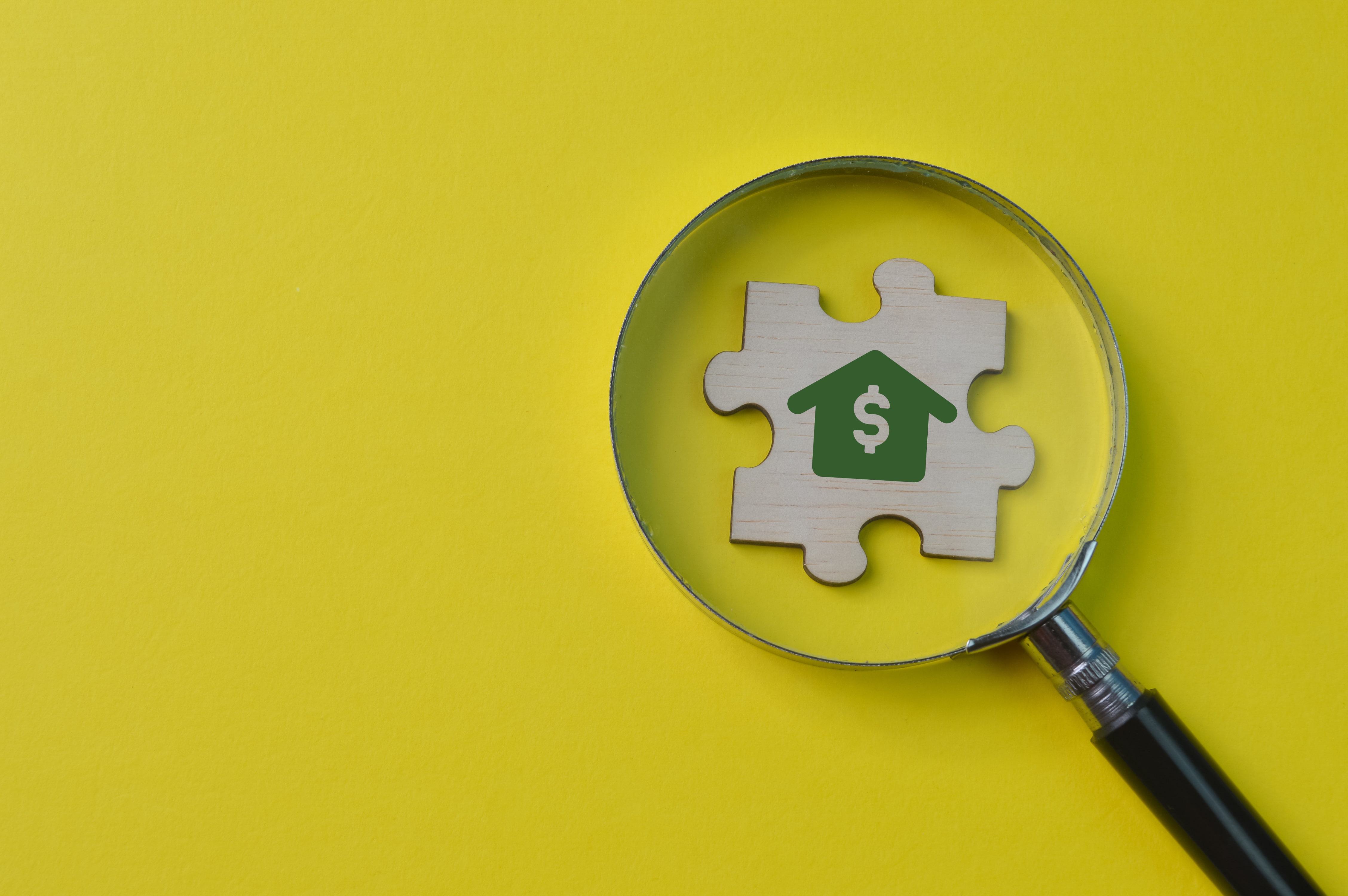 wooden-jigsaw-puzzle-with-home-money-symbol-business-loan-real-estate-concept